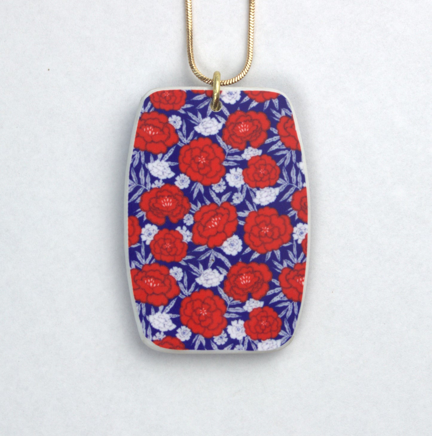 Red and White on Blue and Gold Pendant Necklace