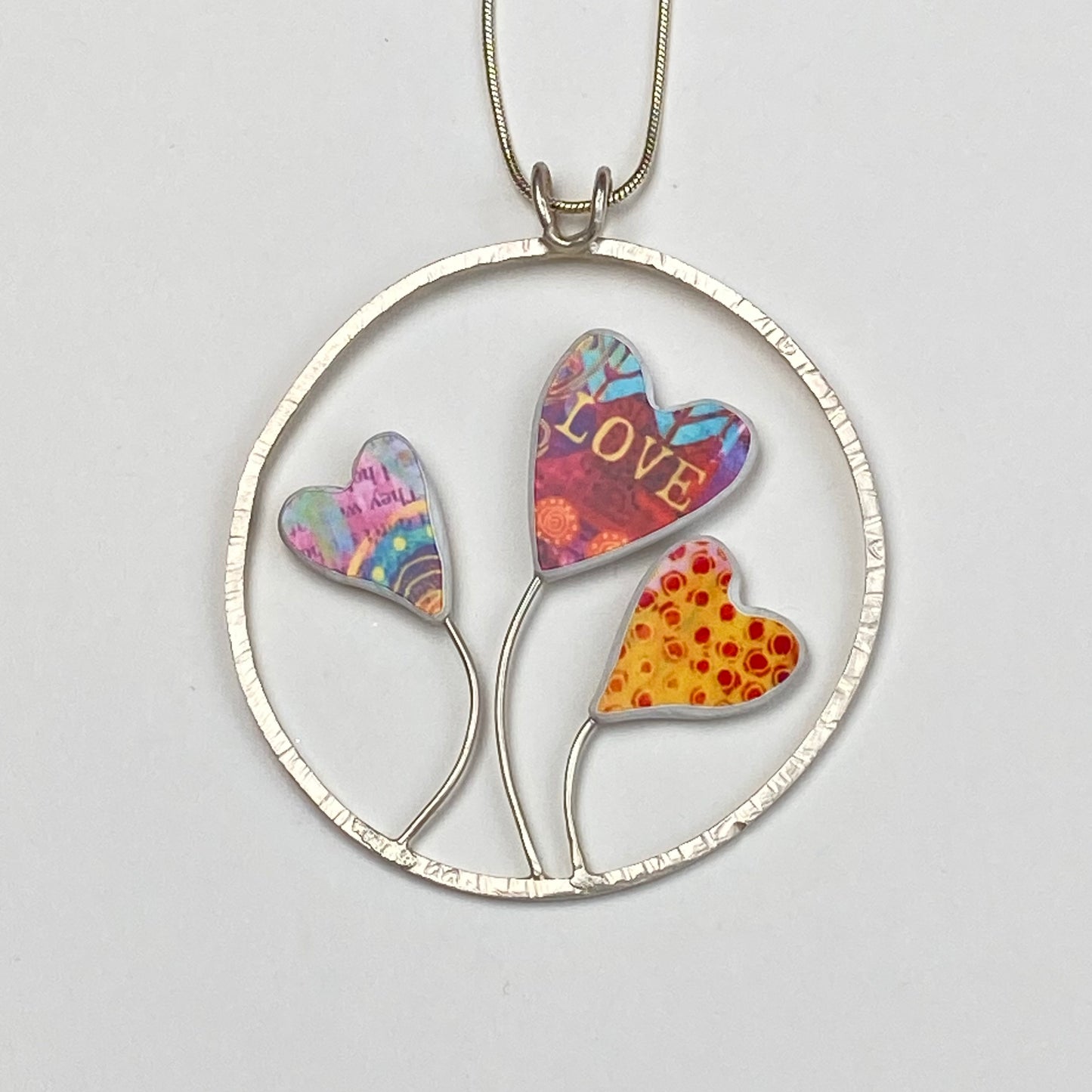 Three Hearts in a Ring Pendant Necklace